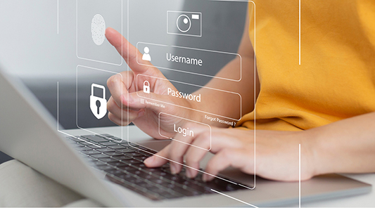 hands typing on laptop