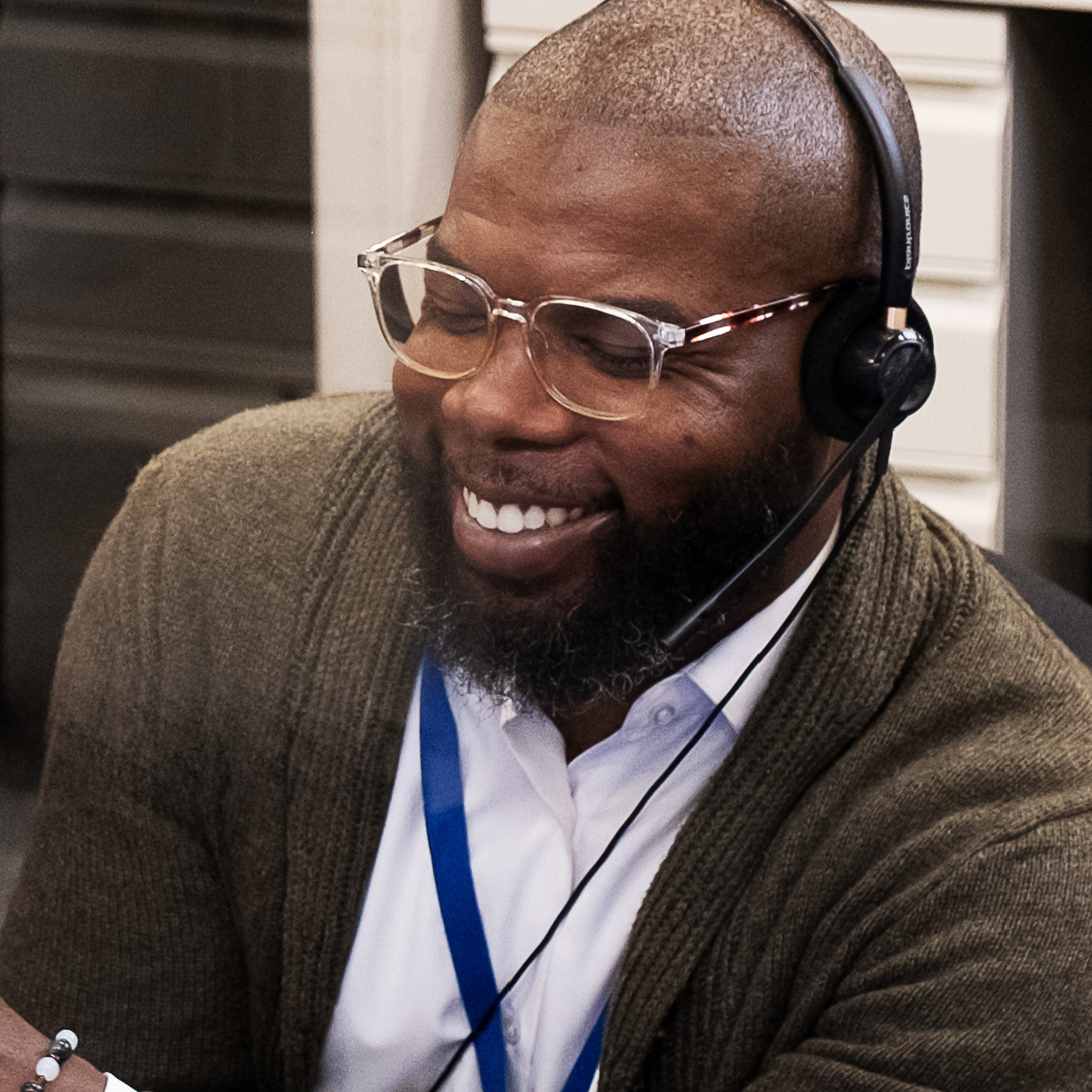 Smiling man on headset