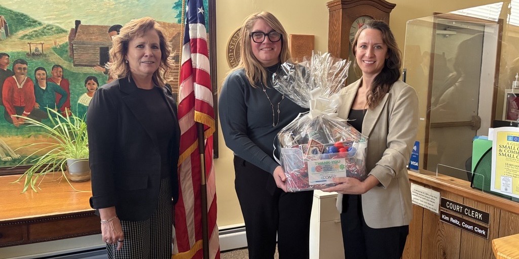 Three women with gift basket